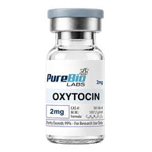 A small glass vial of PureBio Labs Oxytocin 2mg, featuring a white label with blue and black text, a silver metal collar, and a gray cap, isolated on a white background.